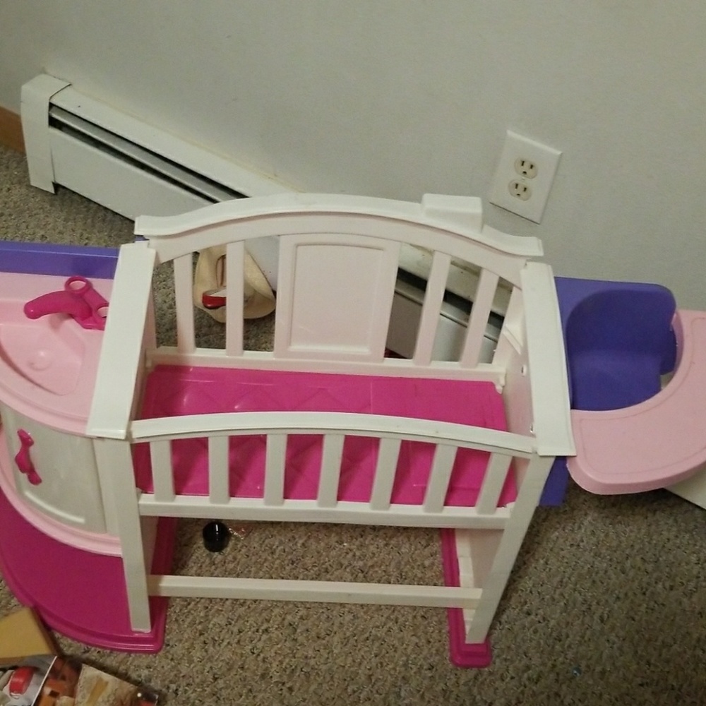 Doll bed with attached high chair and sink